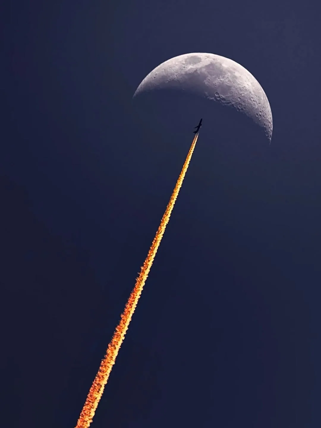 Jet Contrail Meets the Moon